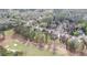 Community aerial view with houses, trees, and a golf course in a well-maintained neighborhood at 5224 Brendlynn Dr, Suwanee, GA 30024