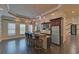 Wet bar featuring counter seating, stainless fridge, and modern lighting at 5224 Brendlynn Dr, Suwanee, GA 30024