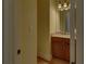 Tiled bathroom features granite countertops and neutral color palette in a simple design at 5224 Brendlynn Dr, Suwanee, GA 30024