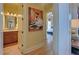 A hall bathroom with vanity and mirror at 5224 Brendlynn Dr, Suwanee, GA 30024