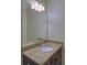 Bathroom vanity with granite countertops and undermount sink at 5224 Brendlynn Dr, Suwanee, GA 30024