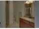 Well-lit bathroom featuring a glass shower, toilet, and granite countertop vanity with sink at 5224 Brendlynn Dr, Suwanee, GA 30024
