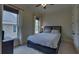 Cozy bedroom with soft carpeting, two windows, and a comfortable bed at 5224 Brendlynn Dr, Suwanee, GA 30024