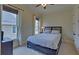 A bedroom featuring a bed and windows at 5224 Brendlynn Dr, Suwanee, GA 30024