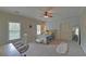 Neutral-toned bedroom with an accent wall, carpet and natural light at 5224 Brendlynn Dr, Suwanee, GA 30024