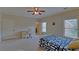 Large bedroom with a ceiling fan, carpet and two windows for plenty of light at 5224 Brendlynn Dr, Suwanee, GA 30024