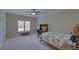 Large bedroom with carpet, natural light and space for study at 5224 Brendlynn Dr, Suwanee, GA 30024