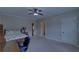 Well-lit bedroom featuring a desk and a view of the ensuite bathroom at 5224 Brendlynn Dr, Suwanee, GA 30024