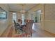 Spacious dining room featuring a chandelier, hardwood floors, and lots of light at 5224 Brendlynn Dr, Suwanee, GA 30024