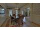 Formal dining room with a chandelier, large windows, and stylish wallpaper at 5224 Brendlynn Dr, Suwanee, GA 30024