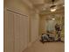 Exercise room with closet space, treadmill, and mirrors at 5224 Brendlynn Dr, Suwanee, GA 30024