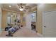 A home exercise room featuring an elliptical machine and a large mirror for monitoring posture at 5224 Brendlynn Dr, Suwanee, GA 30024