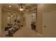 Bright exercise room with a mirror, exercise equipment, and view to sitting area at 5224 Brendlynn Dr, Suwanee, GA 30024