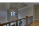 Elegant foyer featuring a decorative chandelier, hardwood floors, and abundant natural light from a large window at 5224 Brendlynn Dr, Suwanee, GA 30024