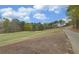 A scenic golf course view features manicured greens, a sand trap, and rolling hills for an enjoyable golfing experience at 5224 Brendlynn Dr, Suwanee, GA 30024