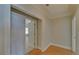 Hallway with hardwood floors leading to a bedroom at 5224 Brendlynn Dr, Suwanee, GA 30024