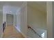 Upstairs hallway with hardwood floors and staircase at 5224 Brendlynn Dr, Suwanee, GA 30024