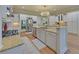A gourmet kitchen with white cabinets, granite countertops, and stainless steel appliances at 5224 Brendlynn Dr, Suwanee, GA 30024