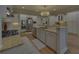 Beautiful kitchen with stainless steel appliances, granite countertops, and a decorative lighting fixture at 5224 Brendlynn Dr, Suwanee, GA 30024