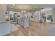 Spacious kitchen with white cabinets, stainless steel appliances, and hardwood floors at 5224 Brendlynn Dr, Suwanee, GA 30024