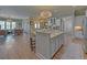An open concept kitchen featuring an island with seating and stainless steel appliances at 5224 Brendlynn Dr, Suwanee, GA 30024
