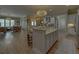 Open kitchen with center island, bar seating, and seamless flow into the adjacent living area at 5224 Brendlynn Dr, Suwanee, GA 30024
