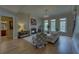 Inviting living room with hardwood floors, fireplace, and abundant natural light at 5224 Brendlynn Dr, Suwanee, GA 30024