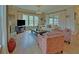 A beautiful living room with large windows, a fireplace, and comfortable seating at 5224 Brendlynn Dr, Suwanee, GA 30024