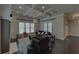 Inviting living room with coffered ceiling, dark hardwood floors, and large windows at 5224 Brendlynn Dr, Suwanee, GA 30024