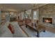 Spacious living room with stone fireplace, hardwood floors, and open floor plan at 5224 Brendlynn Dr, Suwanee, GA 30024