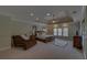 Spacious main bedroom features a tray ceiling, neutral carpet, and multiple windows for natural light at 5224 Brendlynn Dr, Suwanee, GA 30024