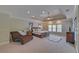 Spacious main bedroom with trey ceilings and sitting area at 5224 Brendlynn Dr, Suwanee, GA 30024