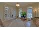 Home office featuring french doors, hardwood floors, and lots of light at 5224 Brendlynn Dr, Suwanee, GA 30024