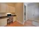Home office with granite counters, custom cabinets, and hardwood flooring at 5224 Brendlynn Dr, Suwanee, GA 30024