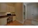 Home office boasts custom cabinetry, granite countertops, and ample natural light at 5224 Brendlynn Dr, Suwanee, GA 30024