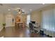 Bright office space with natural light, ceiling fan and adjacent dining area at 5224 Brendlynn Dr, Suwanee, GA 30024