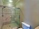 Shower with tiled walls and glass enclosure at 5224 Brendlynn Dr, Suwanee, GA 30024