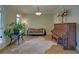 Cozy sitting room with a piano, cowhide rug, and natural light at 5224 Brendlynn Dr, Suwanee, GA 30024