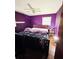 Cozy bedroom with a ceiling fan and a bright window at 1145 Crestview Ne Cir, Conyers, GA 30012