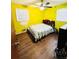 Bedroom features refinished hardwood floors and bright natural light at 1145 Crestview Ne Cir, Conyers, GA 30012