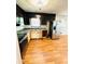 Kitchen featuring black and wooden cabinets, stainless steel appliances and bright natural light at 1145 Crestview Ne Cir, Conyers, GA 30012