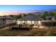 Enjoy outdoor living with a wooden deck and stone patio in a private backyard with mature trees at 313 Bonnie Sue Dr, Villa Rica, GA 30180