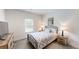 This bedroom features a black metal frame bed, two side tables with lamps, and carpeted floors at 313 Bonnie Sue Dr, Villa Rica, GA 30180