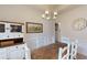 Dining room with a wooden table, chandelier, and accent furniture for a stylish and functional space at 313 Bonnie Sue Dr, Villa Rica, GA 30180