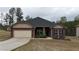 Charming single story home with a brick facade, attached garage, and well maintained lawn at 313 Bonnie Sue Dr, Villa Rica, GA 30180