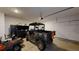 This garage has a 4-wheeler and lawn care equipment at 313 Bonnie Sue Dr, Villa Rica, GA 30180