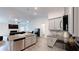 Open-concept kitchen featuring stainless steel appliances, granite countertops, and a view into the living room at 313 Bonnie Sue Dr, Villa Rica, GA 30180