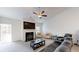 Cozy living room features a fireplace, large TV, comfortable seating, and ample natural light at 313 Bonnie Sue Dr, Villa Rica, GA 30180
