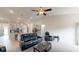 Open concept living area with modern furnishings, including a plush sofa, TV, and open access to the kitchen at 313 Bonnie Sue Dr, Villa Rica, GA 30180