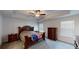 Main bedroom with ceiling fan, tray ceiling and ensuite bath with a patriotic theme at 313 Bonnie Sue Dr, Villa Rica, GA 30180